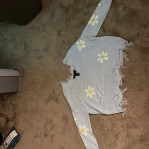 has hanging threads from the V-neck and the bottom that’s just how it’s made